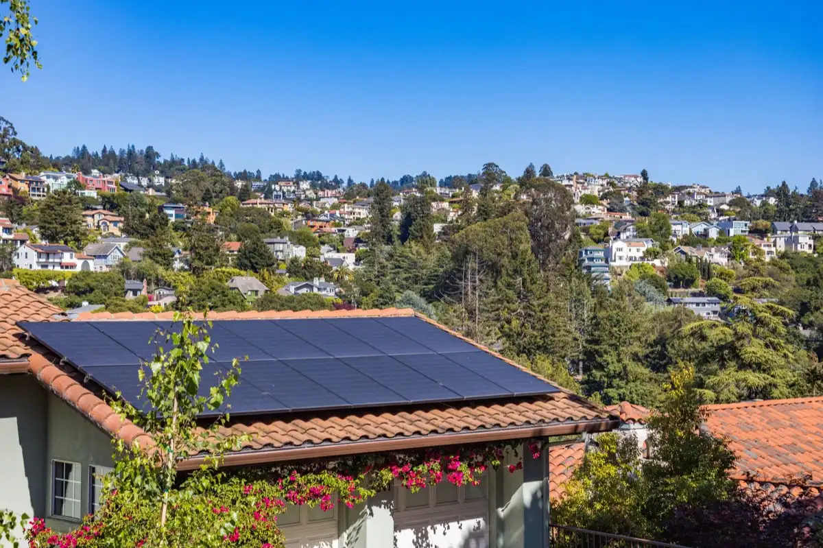 Hips and valleys across a run of rooflines in Vallejo, CA, where two planes meet and hand their water to one line